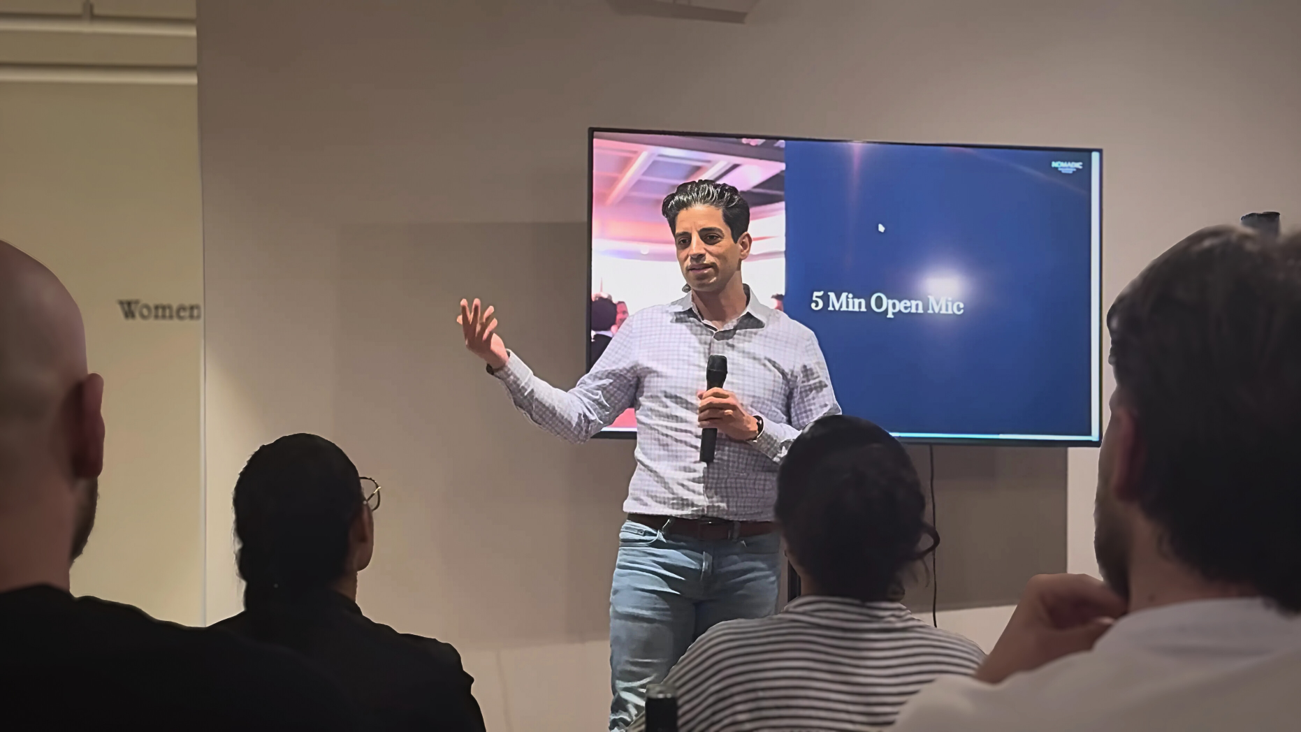 Basim Mousilli speaking with a microphone